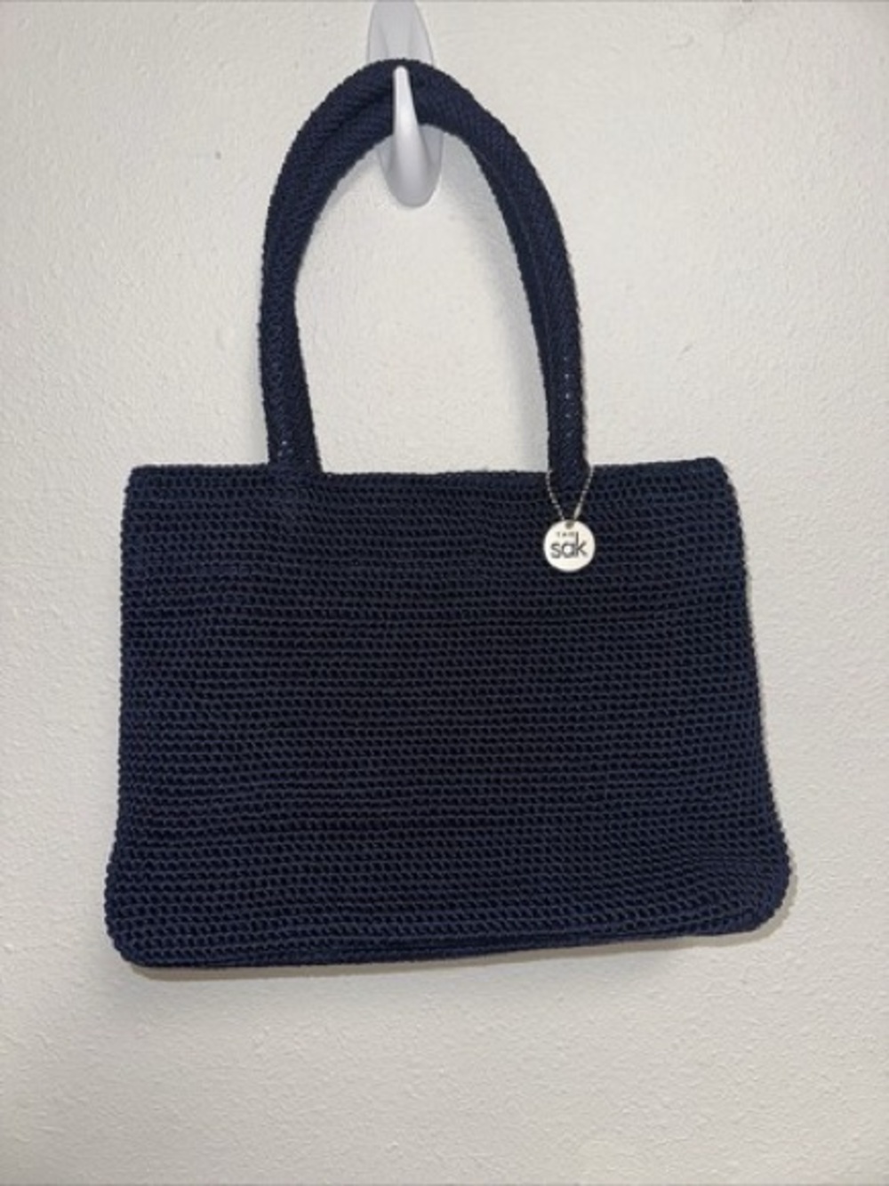 The Sak Navy Crochet Tote with Branded Charm